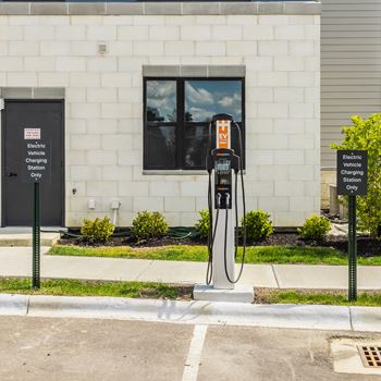 An electric vehicle charging station sits outside a building at Upper Vue Flats, Dublin, OH, 43016